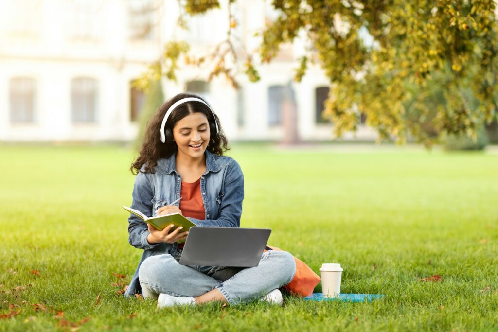 A delighted young Indian lady learner partakes in a web-based